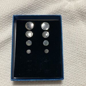 Black metal disc pierced earrings. Set of 4.